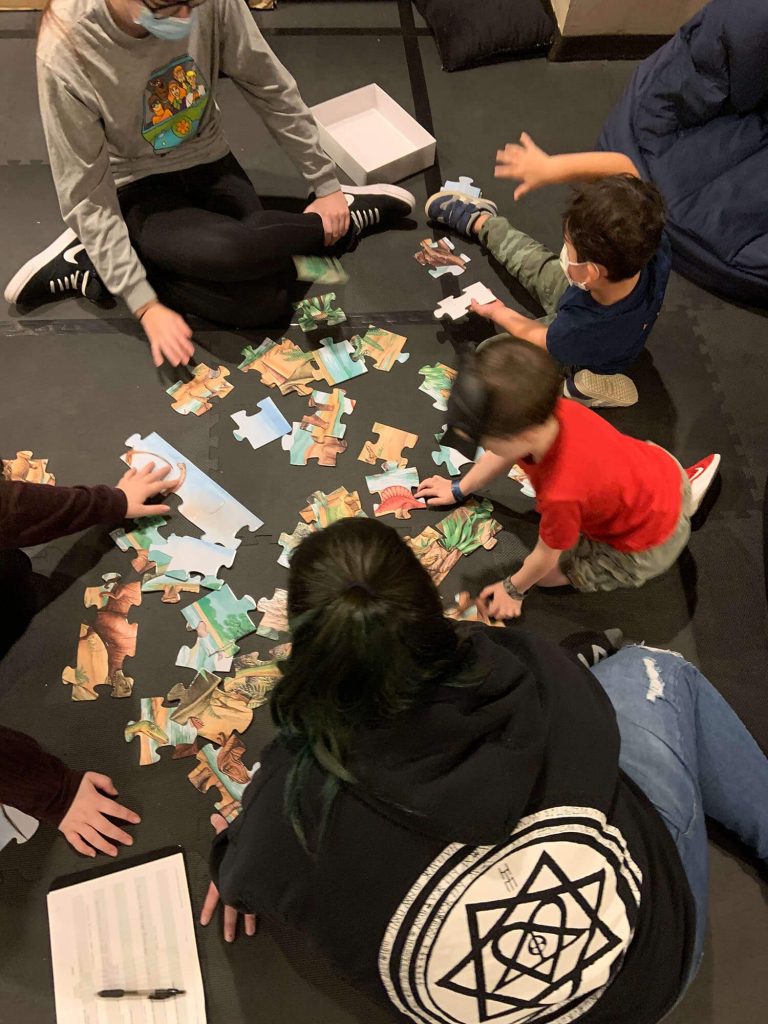 Children playing with puzzles at My World ABA