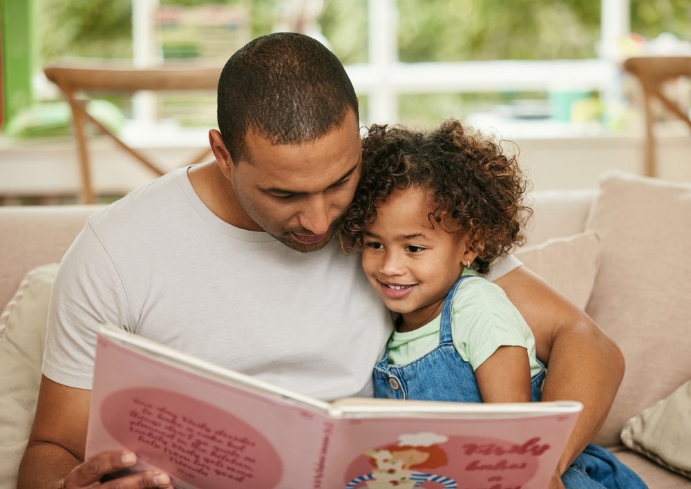 Father and daughter reading together