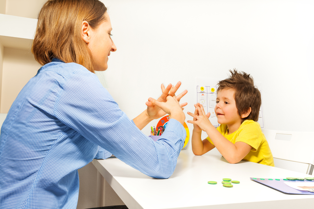 Boy exercising fingers and motor skills