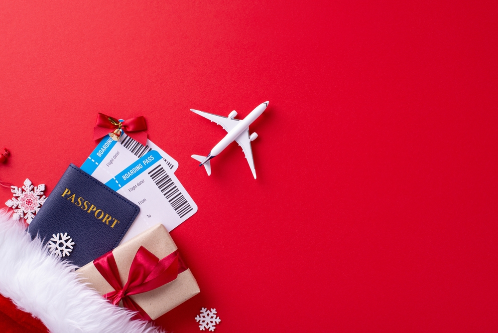 ABA therapy holiday travel concept with a passport, plane tickets, and a wrapped present