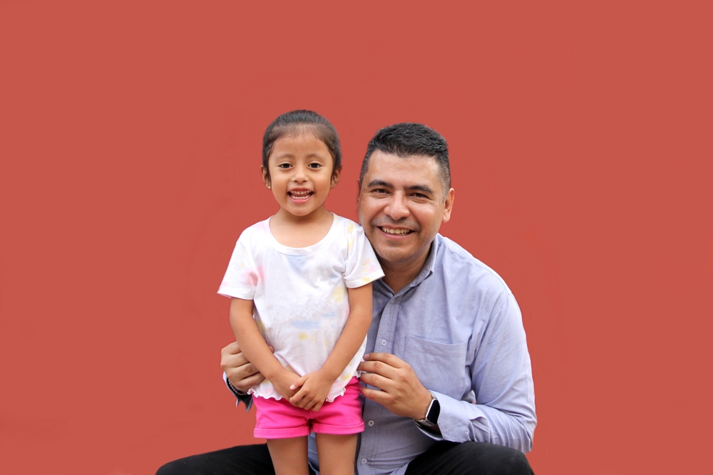 Dad working with a child with autism after ABA therapy parent training