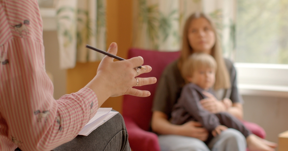 Parent and child diagnosed with autism at an ABA therapy consultation